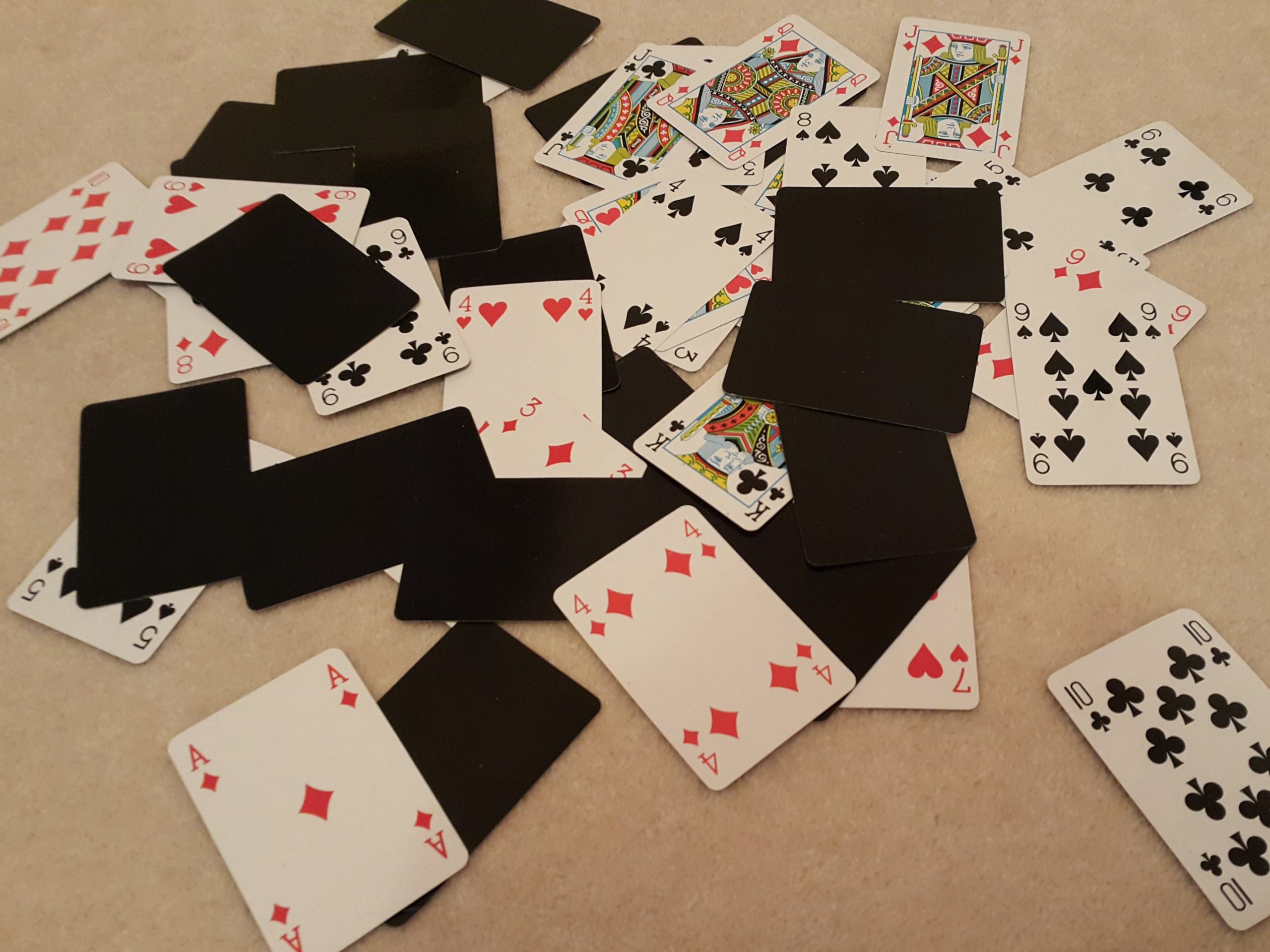 Playing cards spread on floor